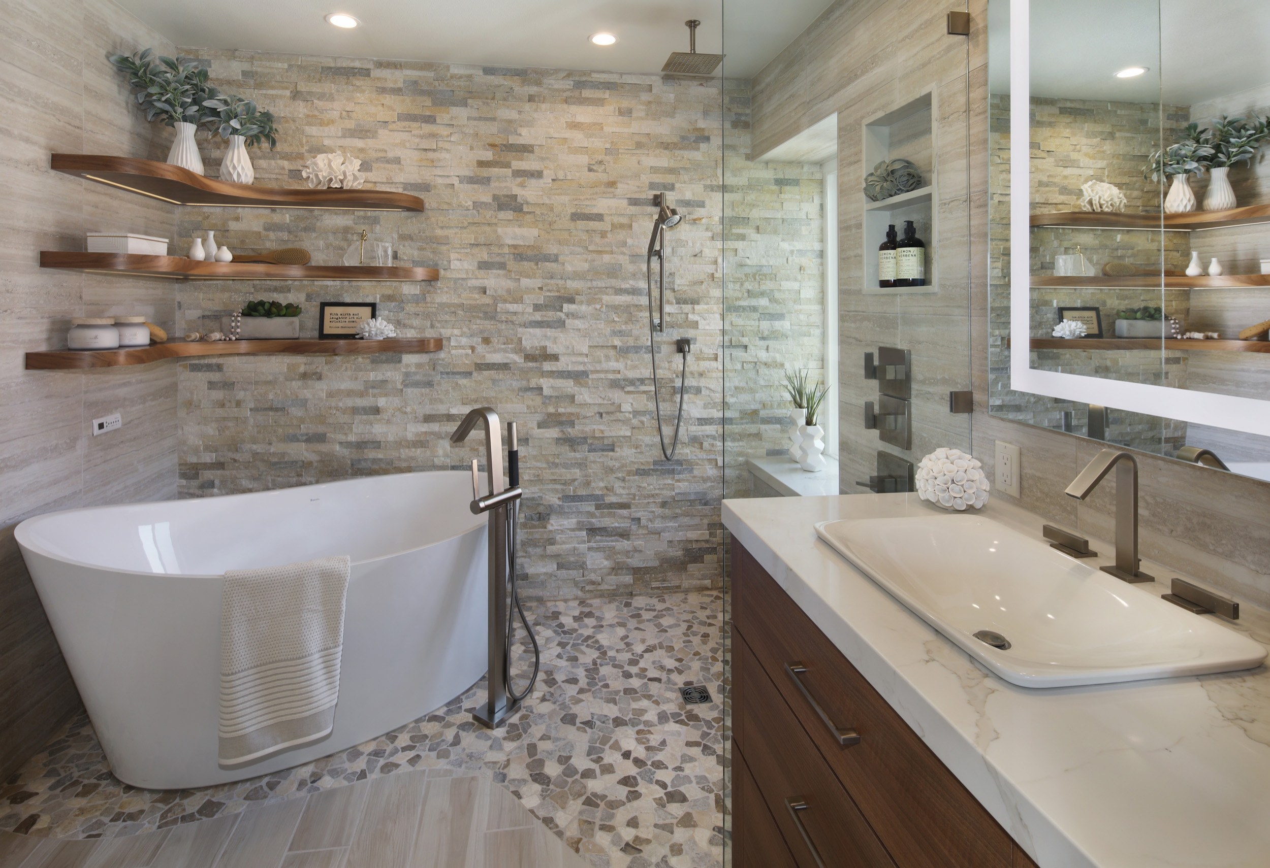 Master bath with freestanding tub, stacked stone wall and pebble floor, Laguna Niguel remodel